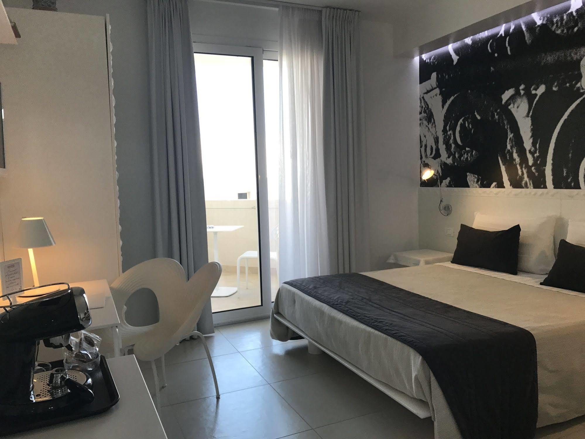 Quihotel Porto Cesareo Bagian luar foto